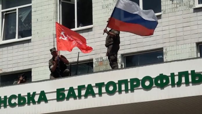 Image released by the People's Militia of the Luhansk People's Republic on July 3, 2022 shows their forces put Soviet and