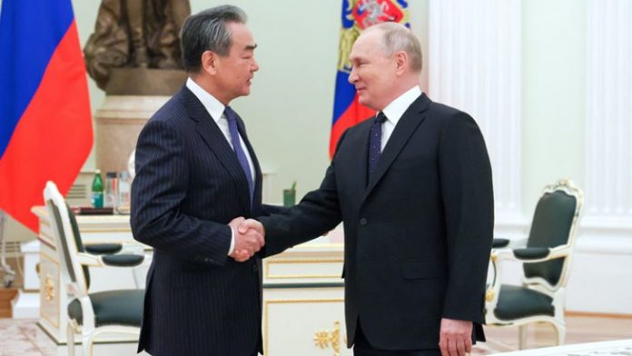 Russia's President Vladimir Putin meets with China's top diplomat Wang Yi in Moscow